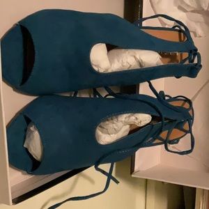 Blue Suede sling back tie up heels.  Heel is approx. 4 inches